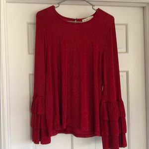Long sleeve, red sparkly top with fluted sleeves